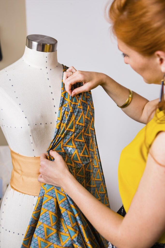 Fashion designer working at mannequin